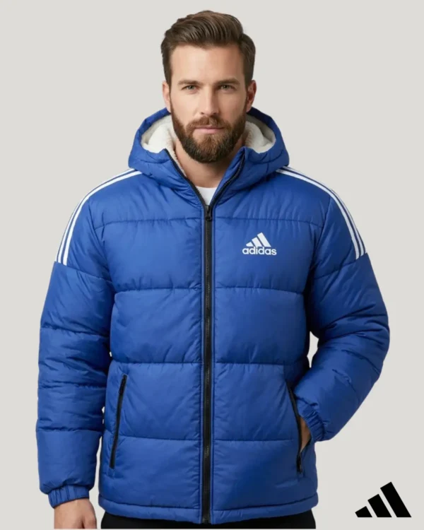 Men's minus temperature royal blue hooded sherpa jacket with warm white fleece lining, full zip closure, white shoulder stripes, and zippered pockets.