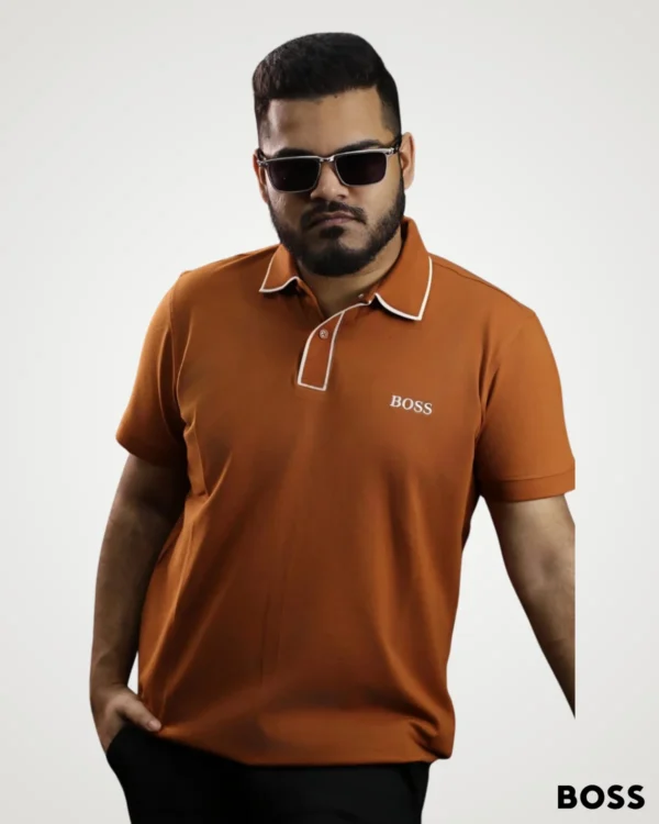 Men's terracotta rust polo shirt featuring white piping accents along the collar and placket by Signature Lifestyle