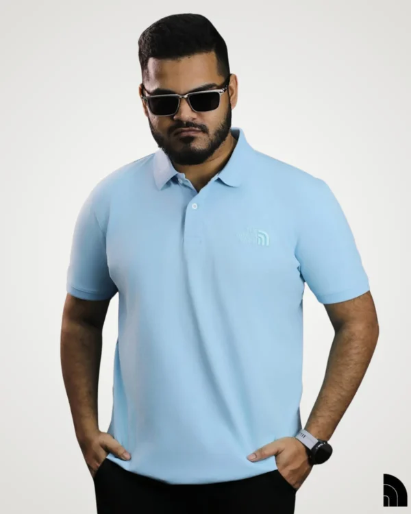 Men's light sky blue polo shirt with classic collar design and tone-on-tone embroidered logo by Signature Lifestyle