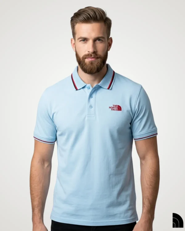 Men's casual light sky blue polo shirt with distinctive red and black striped tipping on the collar and cuffs, featuring an embroidered chest logo by Signature Lifestyle