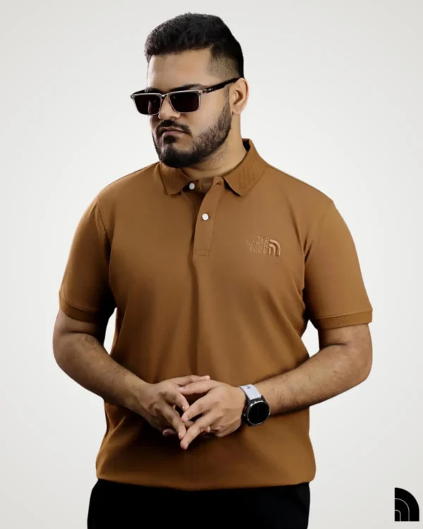 Men's casual brown solid polo shirt featuring textured collar details and subtle chest logo by Signature Lifestyle