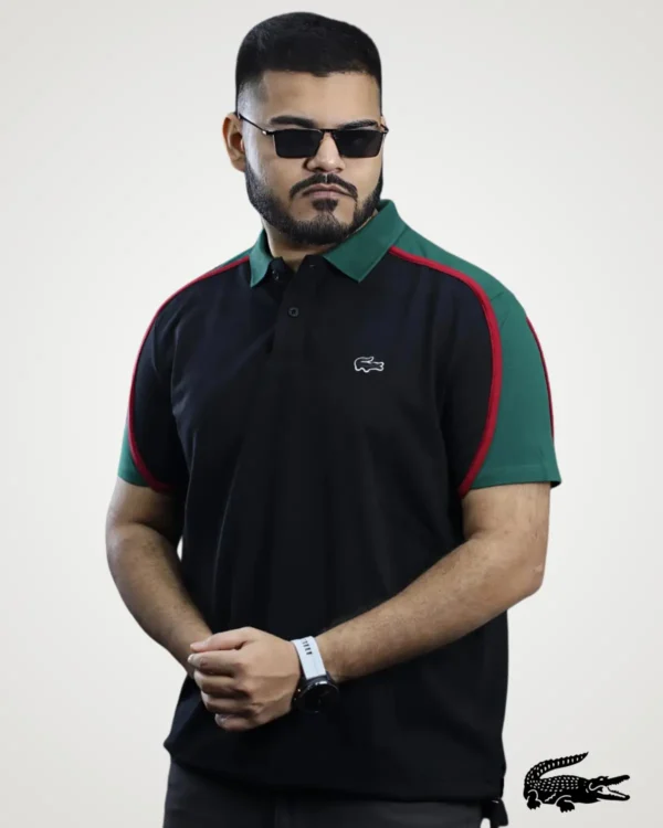 Men's black polo shirt featuring a dark green collar, green short sleeves, and red accent piping by Signature Lifestyle