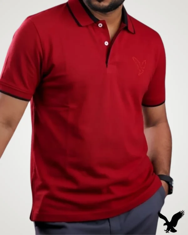 Men's casual red polo shirt featuring black contrast collar tipping and matching eagle chest embroidery by Signature Lifestyle