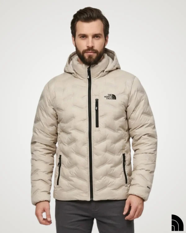 Man wearing a beige lightweight down jacket with hood, slim quilted puffer design with contrast black zips and side pockets