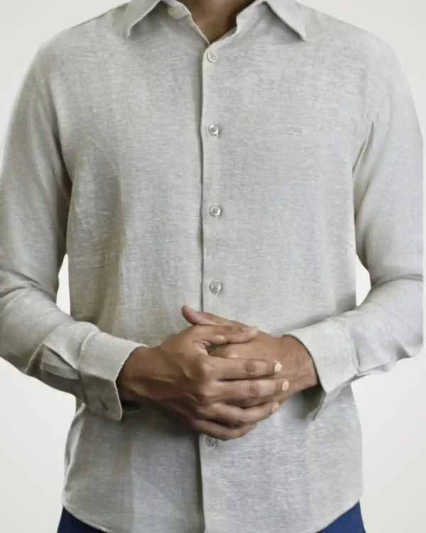 Front torso shot of a man wearing a light grey men's rayon cotton shirt with melange linen-like texture, spread collar, and full button-down front.