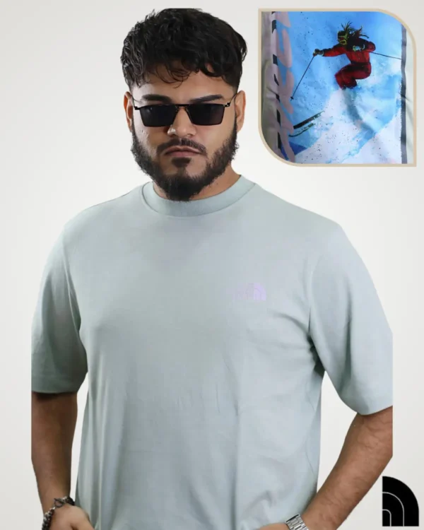 Men's mint green graphic t-shirt with red skier action back print, crew neck casual sports tee